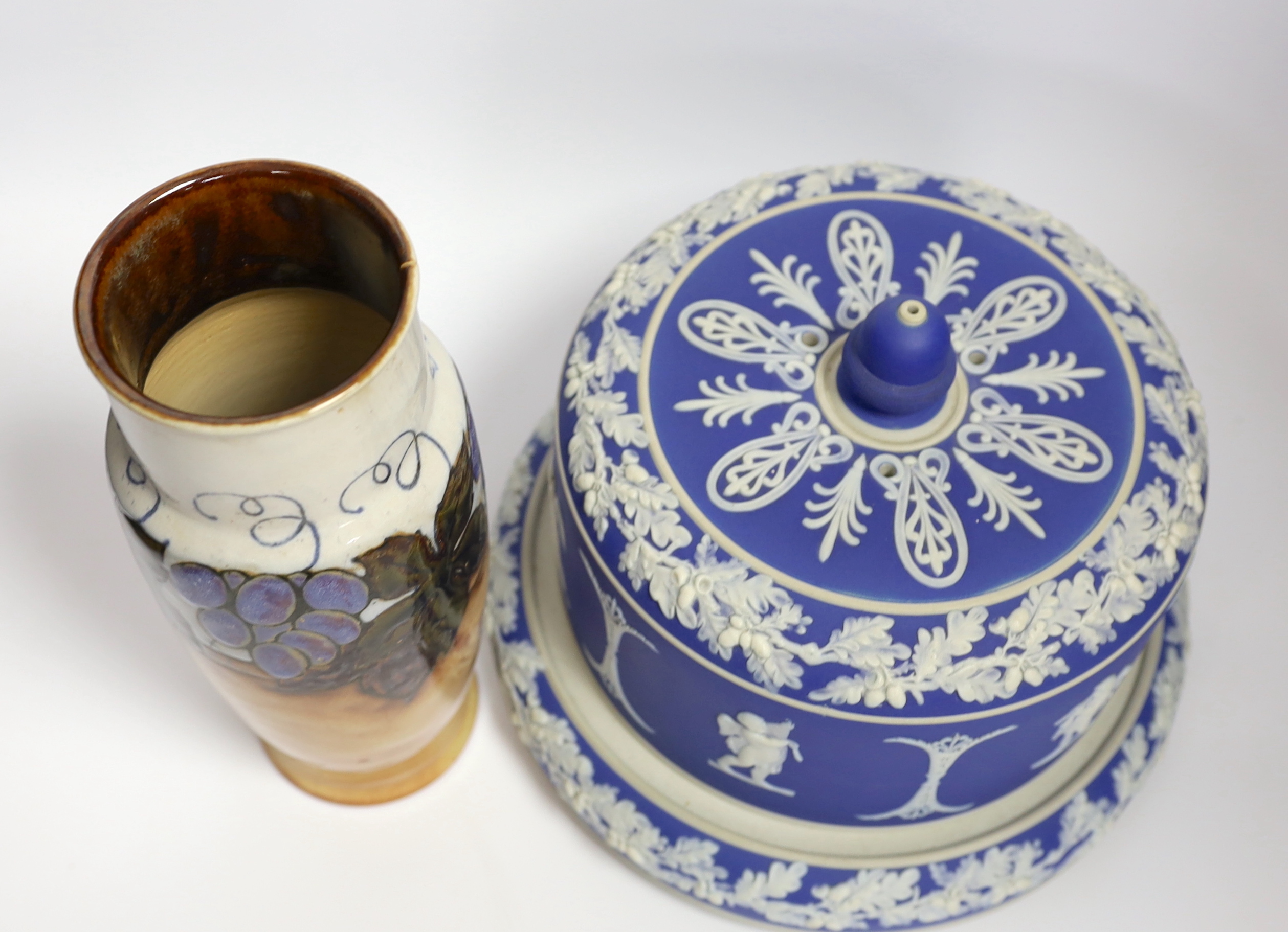 A Victorian blue Jasperware cheese dome with a on knop and Royal Doulton grapevine vase, largest 26cm high